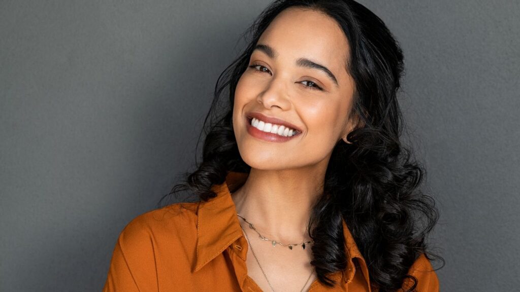 Happy latin beautiful woman smiling